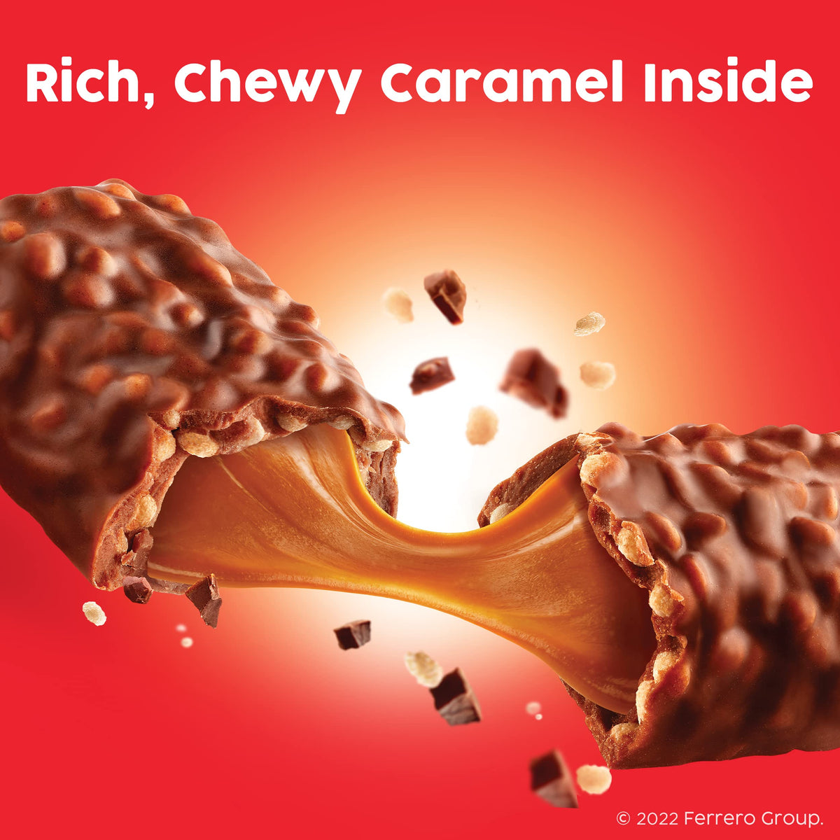 Cross-section of 100 Grand bar revealing caramel, milk chocolate, and crispy crunch.