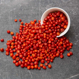 Close-up of chiltepin heat, showing intense peppers for fiery recipes.