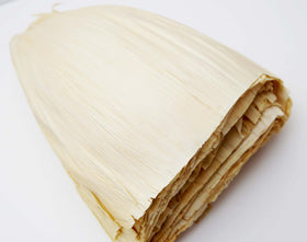 1400S Spices plated tamales showcasing husk-wrapped delights