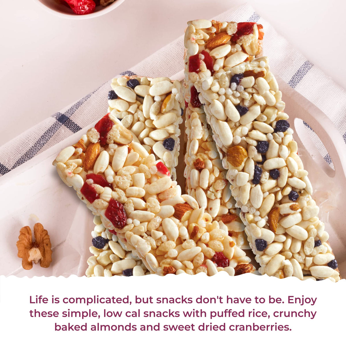 180 Snacks Skinny Rice Bar Cranberry & Almond closeup shows almonds and cranberries for wholesome snacking.