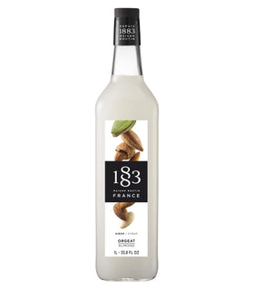 1883 MAISON ROUTIN almond syrup bottle closeup for premium cocktails and desserts.