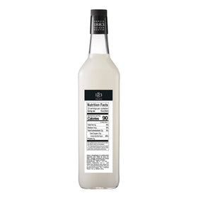 1883 MAISON ROUTIN almond syrup with a cocktail setup.