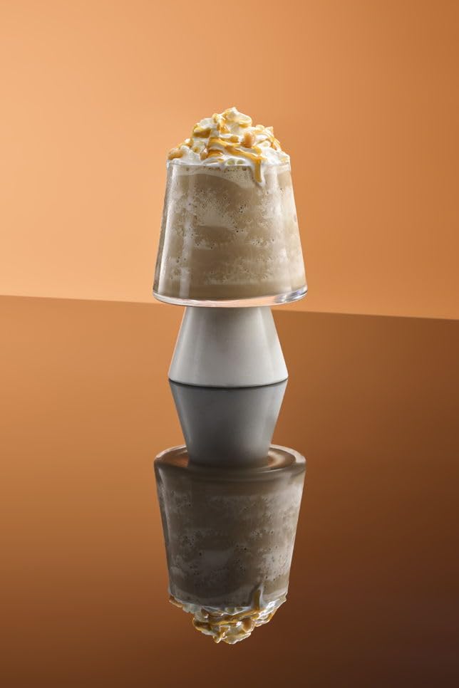 Cocktail mixer with 1883 caramel syrup for gourmet beverages.