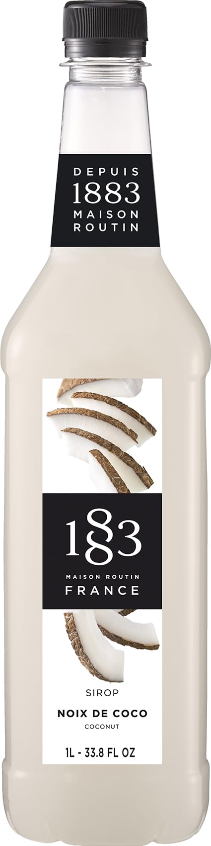 1883 Maison Routin Coconut Syrup bottle on a counter to elevate beverages.