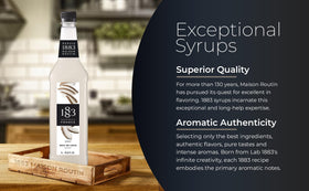 1883 Maison Routin Coconut Syrup poured into coffee to add tropical flavor.