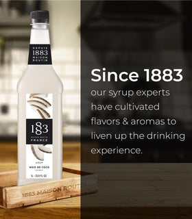 1883 Maison Routin Coconut Syrup dessert drizzle over a pastry.