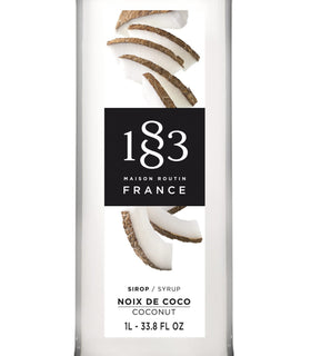 1883 Maison Routin Coconut Syrup dispensing shot ready to sweeten drinks.