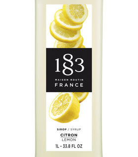 1883 MAISON ROUTIN lemon syrup being poured into a glass for bright cocktails