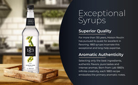 1883 Maison Routin Pure Cane Sugar Syrup bottle in cocktail scene, elevate mocktails.