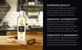 1883 Maison Routin Yuzu Syrup cocktail setup with glass and citrus