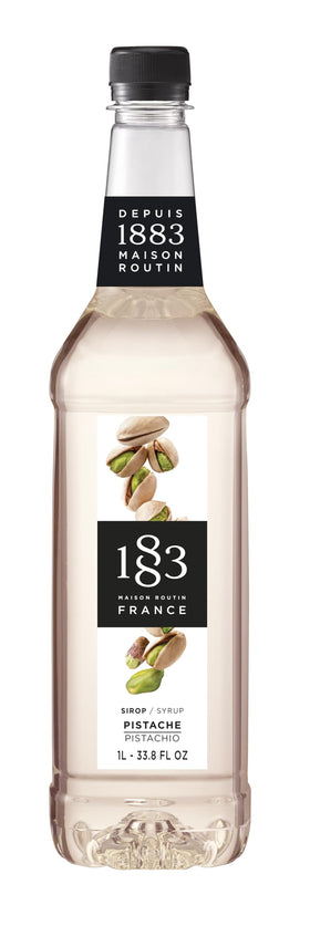 1883 Pistachio Syrup bottle being poured for coffee and cocktails