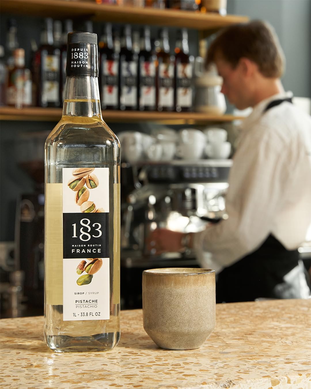 1883 Pistachio syrup in a milk coffee shot for indulgent drinks.