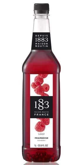 1883 Raspberry Syrup bottle boosts flavor in cafe beverages.