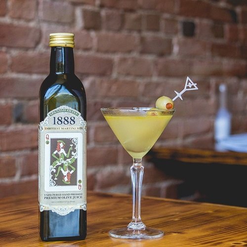 1888 Dirtiest Martini Mix cocktail glass scene showcases bar-quality flavor at home.