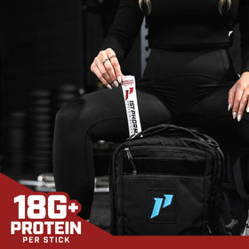 Close-up of 1st Phorm Meat Sticks texture with smoky BBQ coating.