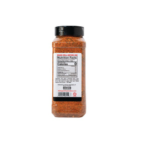 Pouring 2 Gringos Chupacabra rub for even meat coating and enhanced crust