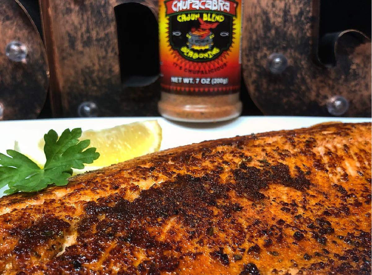 2 Gringos Chupacabra Cajun seasoning sprinkled on vegetables for flavor boost