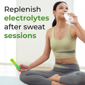 310 Nutrition hydration powder dissolving in water in a glass for a refreshing boost.