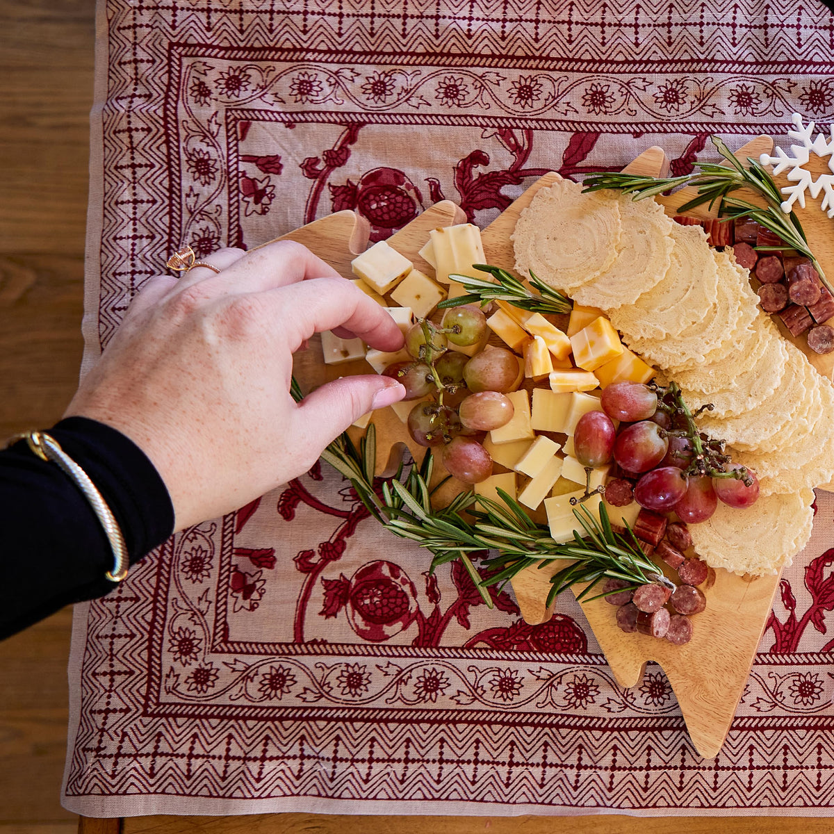 34 Degrees Rosemary Crisps accompany cheese and charcuterie on a board.