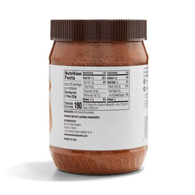 365 by Whole Foods Market almond butter texture close-up, smooth and spreadable for toast.