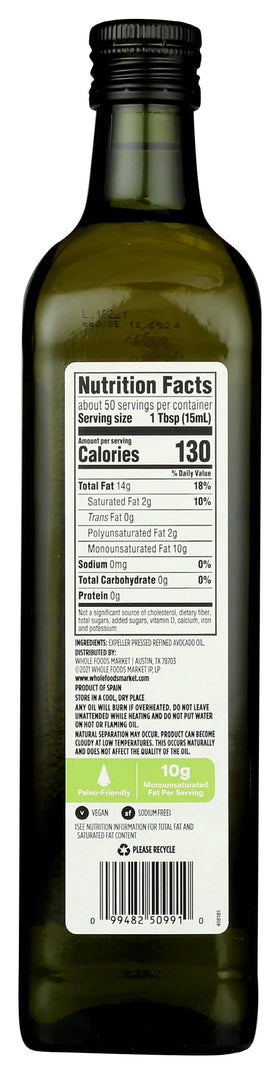 Pouring 365 by Whole Foods Market avocado oil for cooking