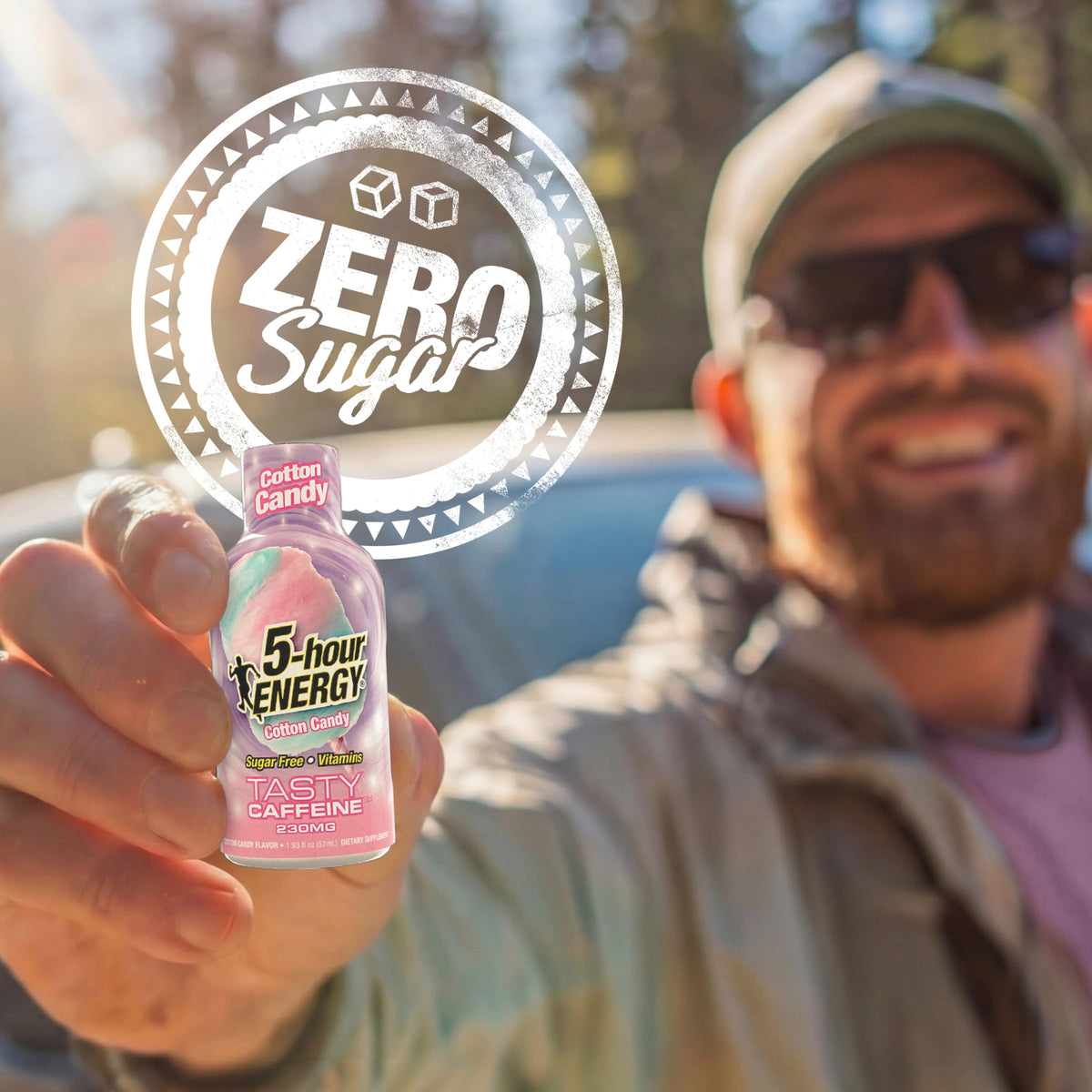 5-hour ENERGY Cotton Candy shot in hand showing quick caffeine boost