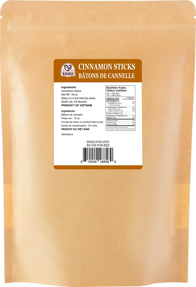 52USA cinnamon sticks on a wooden surface showing raw quality.
