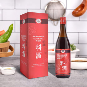 Wok with steam and 52USA Shaoxing wine adding aroma.