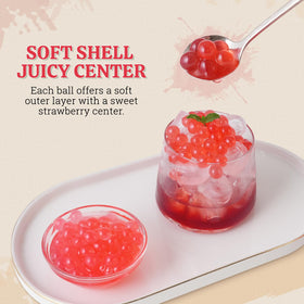 52USA popping boba pearls added to milk tea for bursting strawberry flavor.