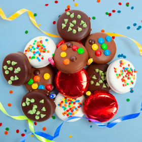 A Gift Inside chocolate-coated sandwich cookies closeup in milk, white, and dark chocolate.