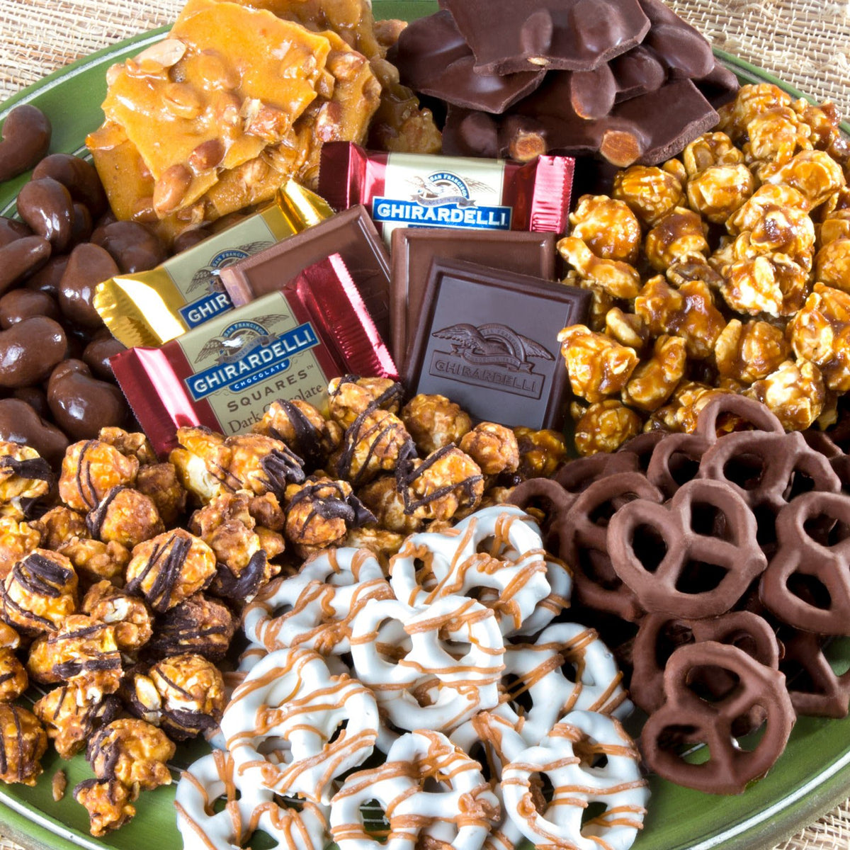 Two bags of caramel corn and assorted treats beautifully arranged.