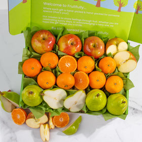 A Gift Inside Fruitfully Trio comice pears close-up highlighting creamy, juicy bites.
