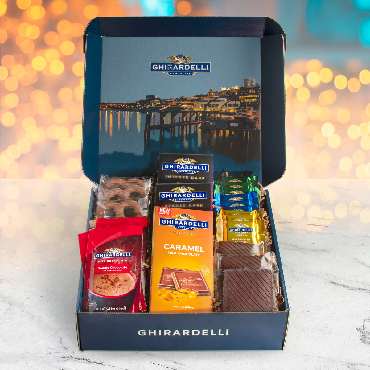 A Gift Inside Ghirardelli box inside arrangement showcasing curated chocolates for sharing.