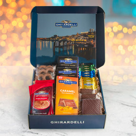 A Gift Inside Ghirardelli box inside arrangement showcasing curated chocolates for sharing.