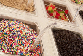 A Great Surprise Rainbow Sprinkles atop cake for festive color and texture