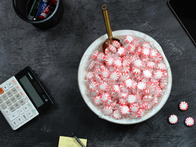 Red and white swirl mints add festive flair to counters.