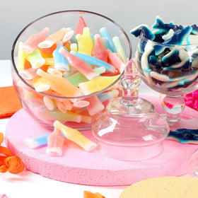 A Great Surprise Groovin' Green wax bottle candy in a clear bag, perfect for goodie bags.
