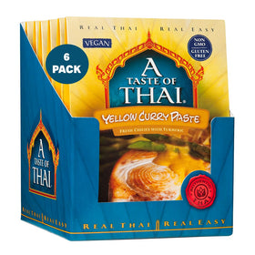 A Taste of Thai Yellow Curry Paste bottle with vibrant golden color for quick curries.