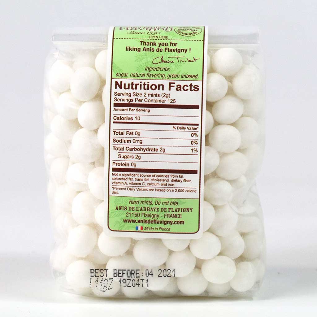 Abbaye de Flavigny anise drops close-up showing sugar-coated grains for a fragrant pick-me-up.