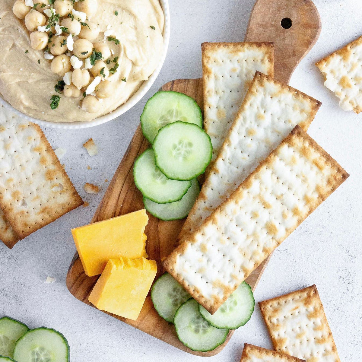 Crispy bite of Absolutely Gluten Free Flatbread crackers, versatile for cheese pairing.