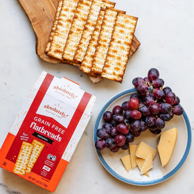 Flatbread pairs with dips on a serving plate, showcasing Absolutely gluten-free.