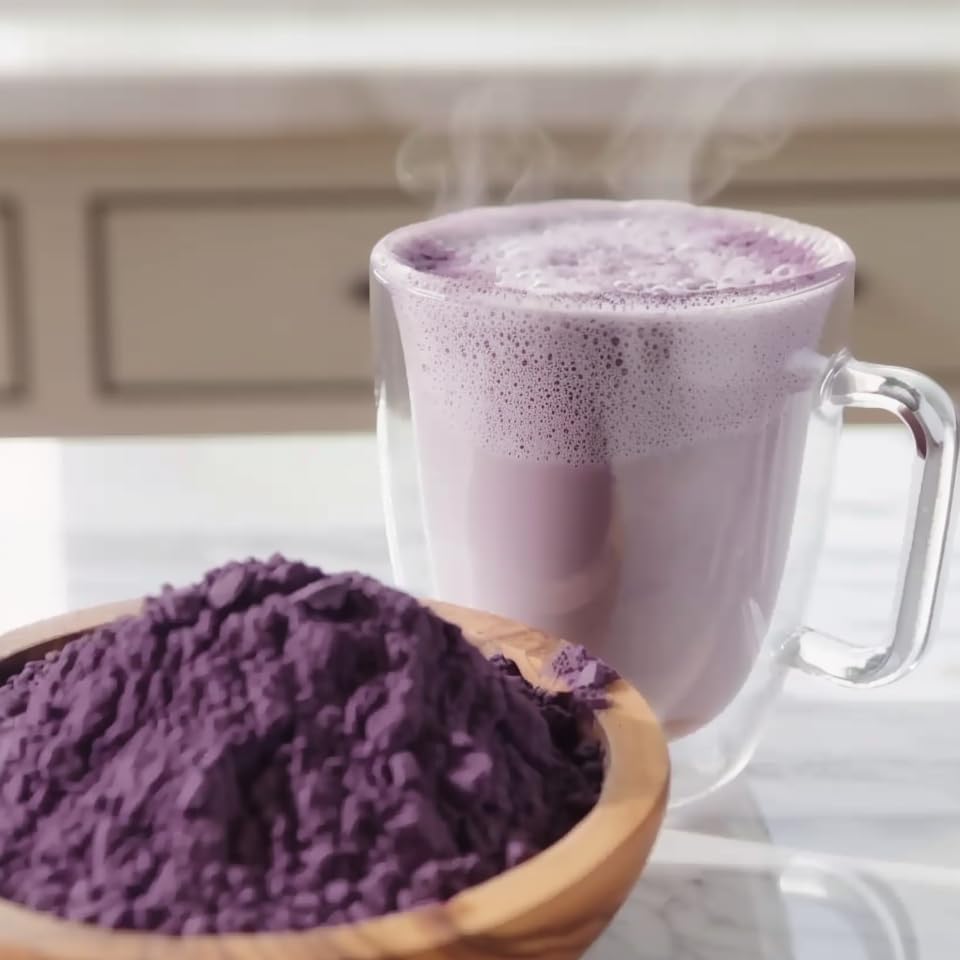 Addictive Wellness Purple Cacao Powder latte cup illustrating versatile use in beverages