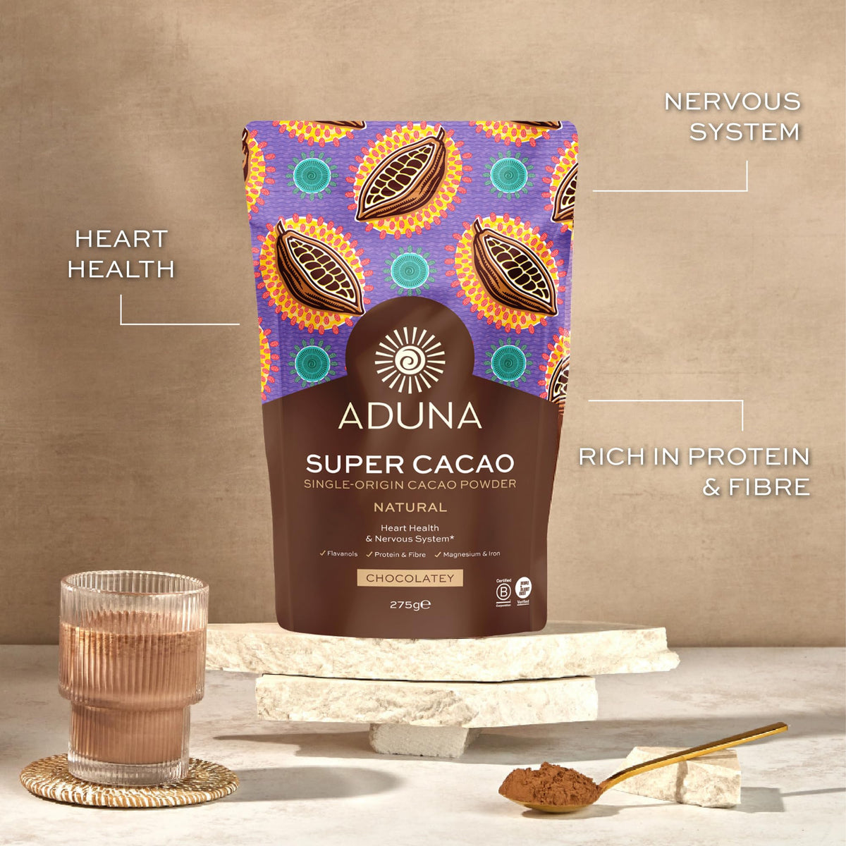Aduna Super-Cacao Powder blending into a vibrant smoothie bowl