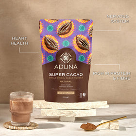 Aduna Super-Cacao Powder blending into a vibrant smoothie bowl