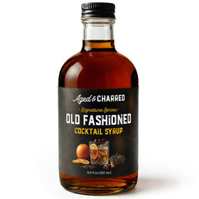 Aged and Charred Old Fashioned syrup bottle close-up for easy, balanced cocktails.