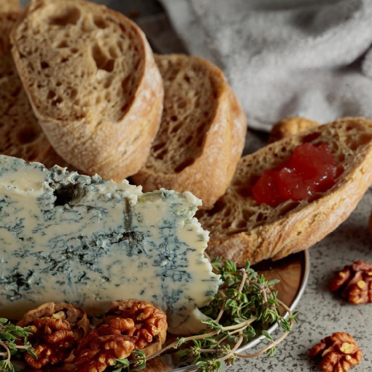 Cheese board featuring Agrisicilia marmalade for citrus contrast and aroma.