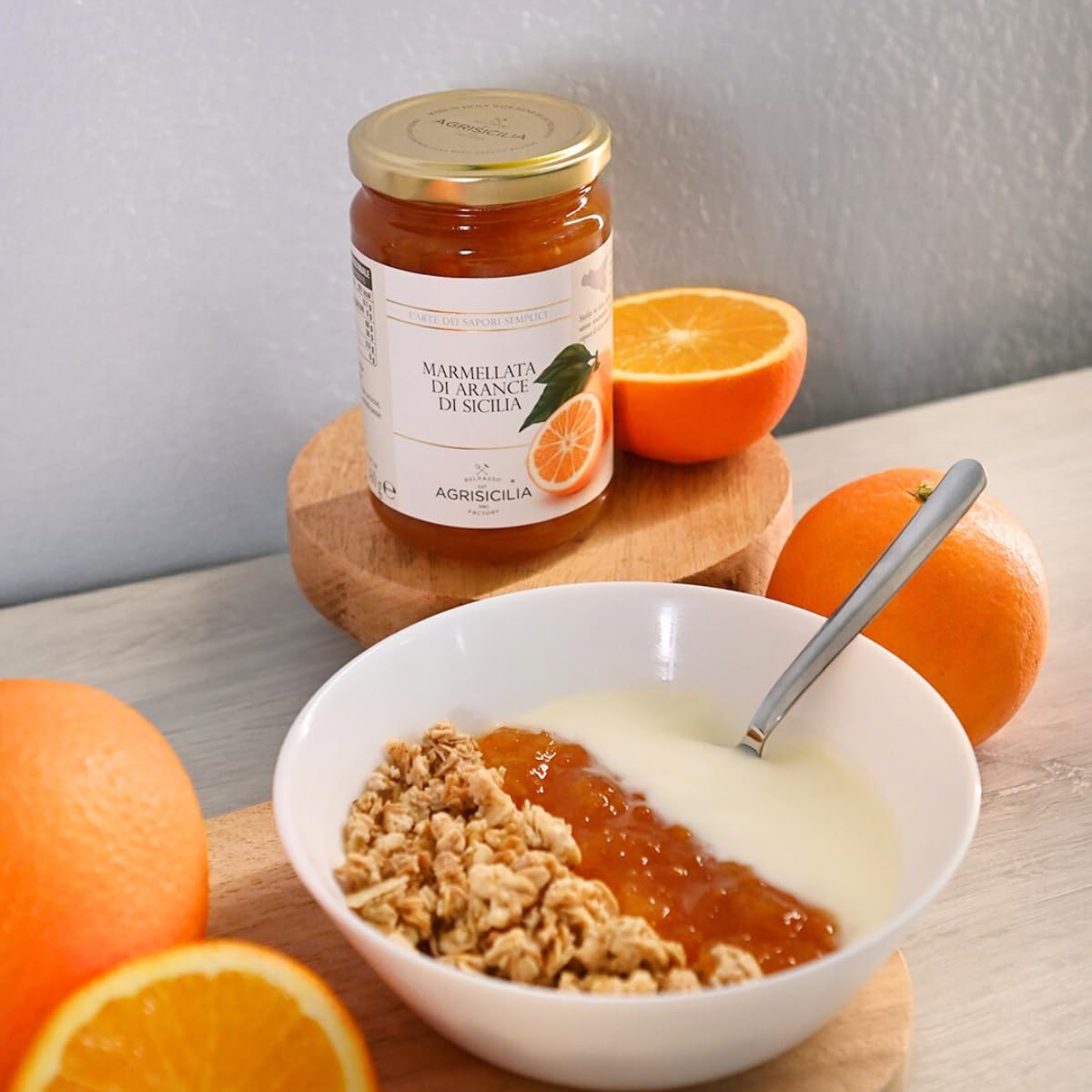 Agrisicilia marmalade being poured from the jar.