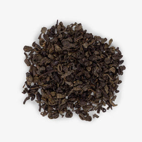 Ahmad Tea green tea leaves steeping setup showcases premium quality and aroma.