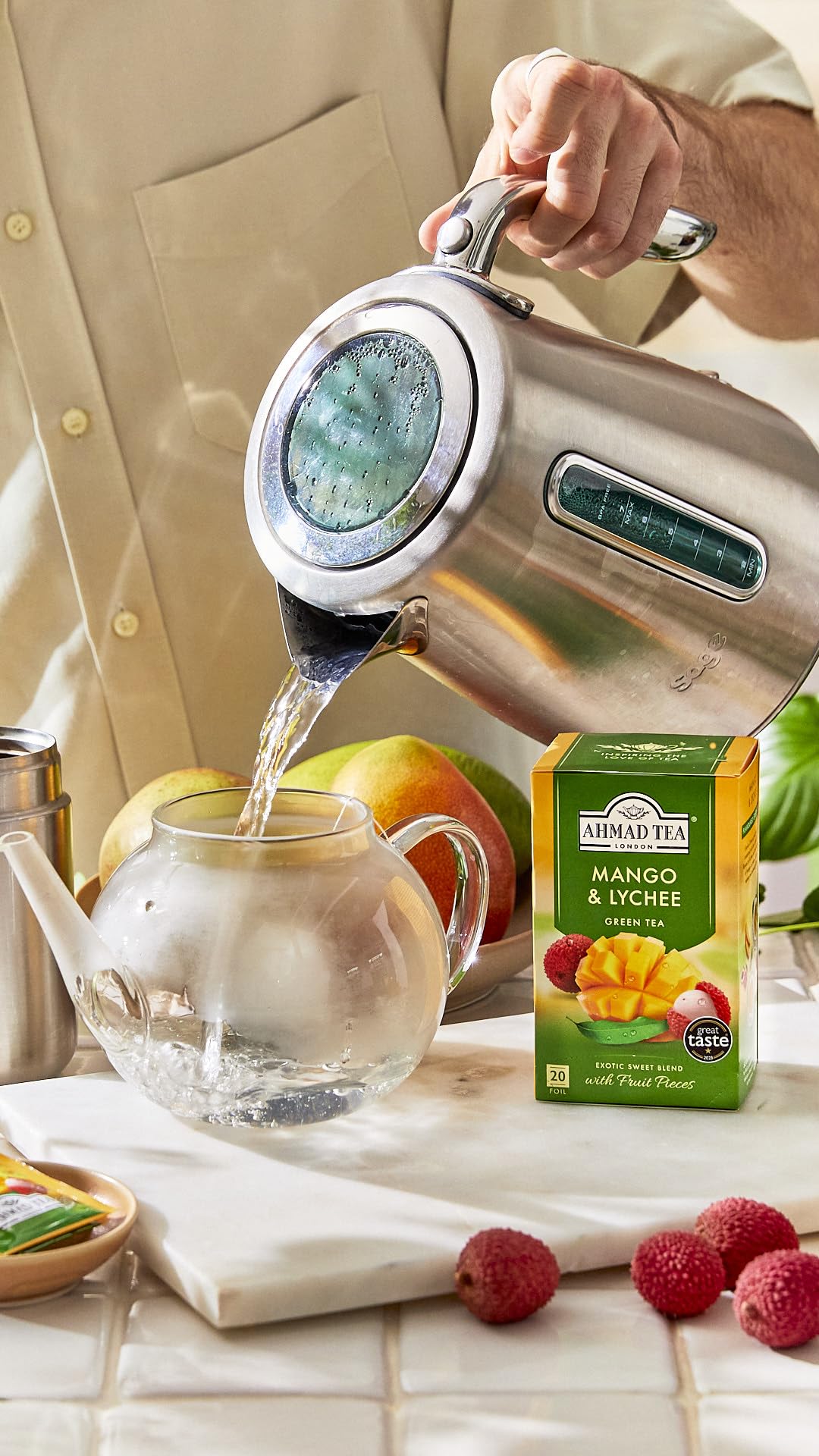 Ahmad Tea Mango & Lychee visuals of mango and lychee hint tropical flavor.