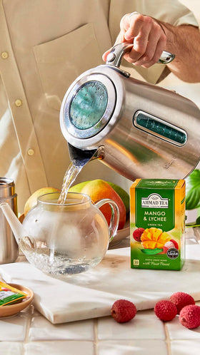 Ahmad Tea Mango & Lychee visuals of mango and lychee hint tropical flavor.